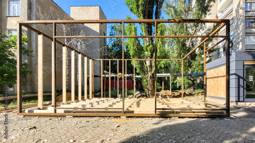 Construction street shopping pavilion for a store, all stages of construction, detailed overview. The second stage - installation of the frame of the walls and roof photo