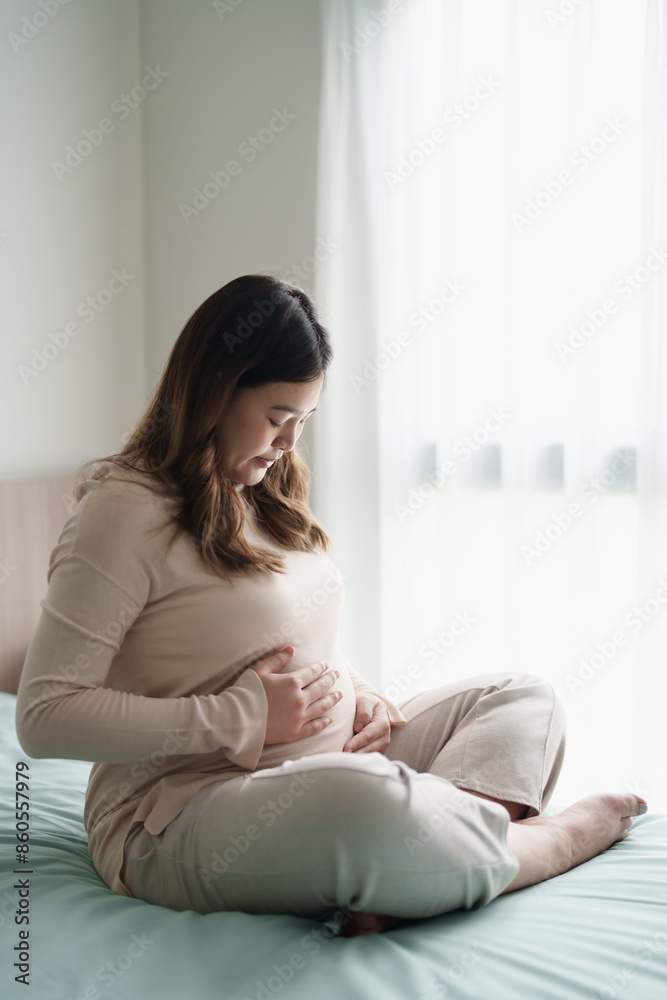 Pregnant woman hand touch on belly caring about her baby health at home Pregnant woman hand touch on belly caring about her baby health at home