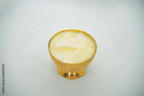 A Copper Bowl filled with Probiotic Yoghurt for Nepali Festival Asaar 15 Dahi Chiura Day Paddy Plantation Day photo