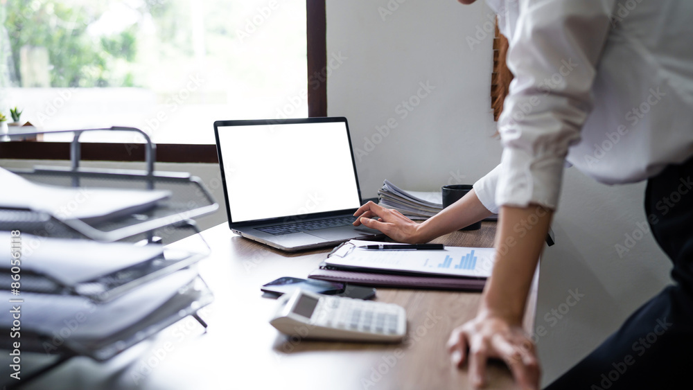 Asian business people working with laptop at office, empty white screen Asian business people working with laptop at office, empty white screen