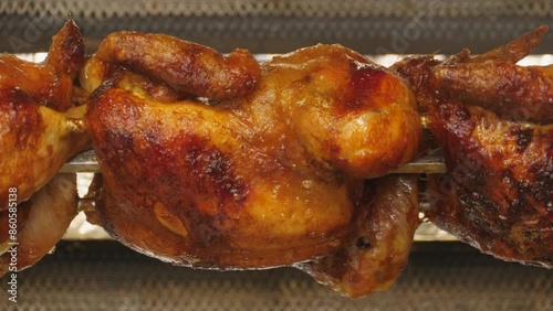 Rotating Grilled Chickens on Barbecue Spit