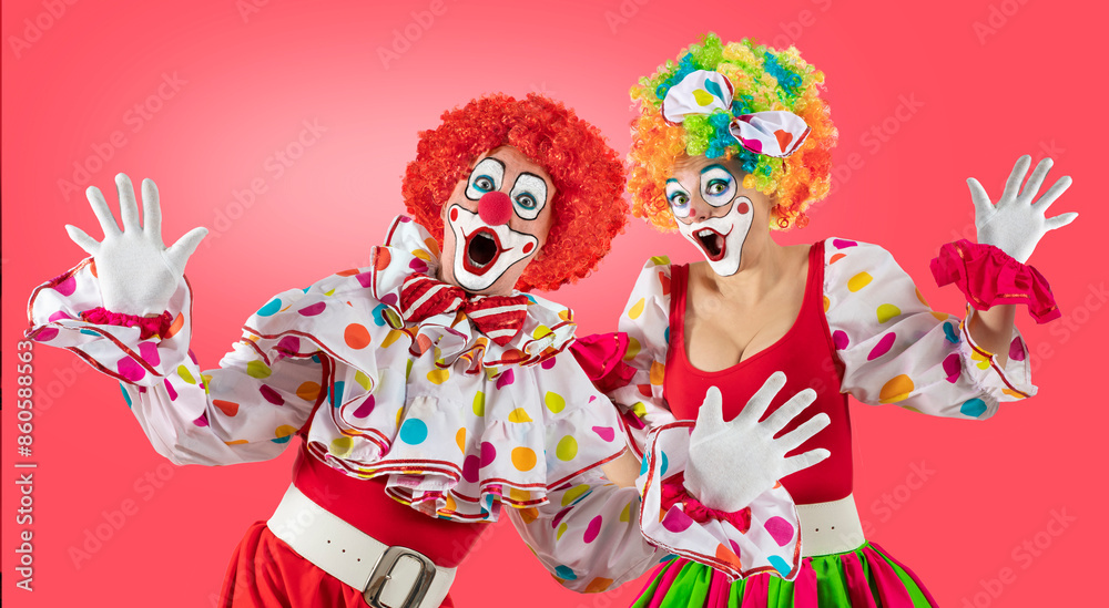Surprised clowns, man and woman entertainers as Joker in a suit and wig, with clown whiteface makeup. Trickster, jester, pantomime, mime, and a professional actors at events, birthday party Surprised clowns, man and woman entertainers as Joker in a suit and wig, with clown whiteface makeup. Trickster, jester, pantomime, mime, and a professional actors at events, birthday party