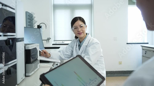 Wallpaper Mural doctors coworking on tablet in lab Torontodigital.ca