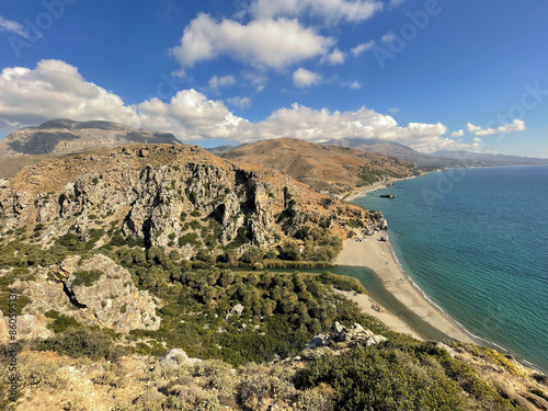 Preveli palm beach and river landscape with mountains on Crete island.