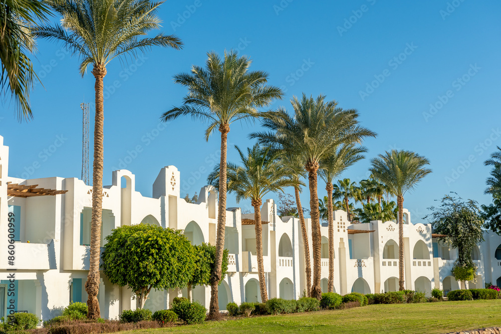 Hotel with white buildings and a recreation area in Egypt. Hotel with white buildings and a recreation area in Egypt.