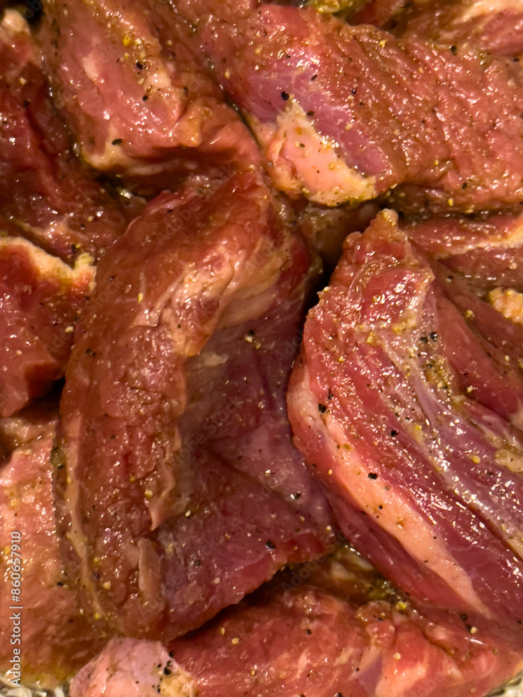 A close up of chucks of beef in a pan A close up of chucks of beef in a pan