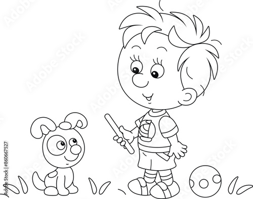 Funny little boy with a small red stick playing and training his merry puppy on a playground in a summer park, black and white vector cartoon illustration for a coloring book