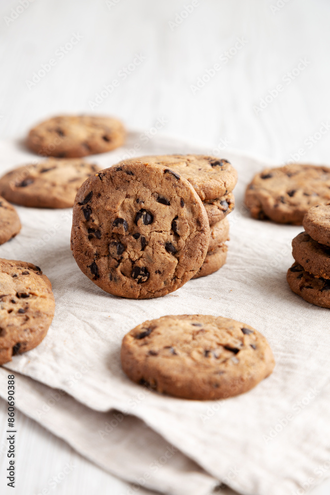 Homemade Gooey Chocolate Chip Cookies on a white wooden background, low angle view. Homemade Gooey Chocolate Chip Cookies on a white wooden background, low angle view.