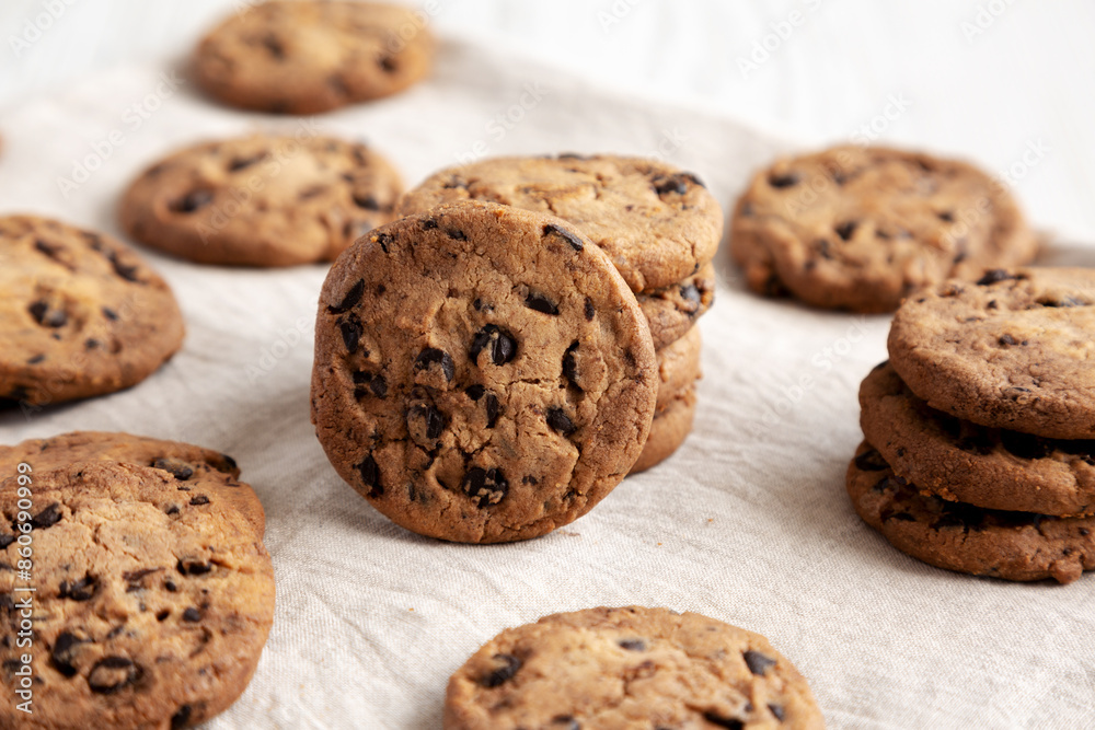 Homemade Gooey Chocolate Chip Cookies on a white wooden background, low angle view. Homemade Gooey Chocolate Chip Cookies on a white wooden background, low angle view.
