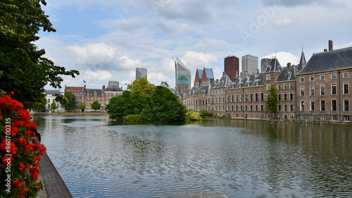 Wide View of Central The Hague on Hofvijver with Binnenhof Frame Right and Red Flowers Frame Left