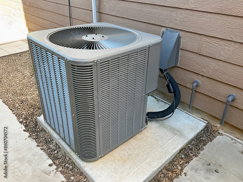 HVAC air conditioning exterior condensing unit of a house.