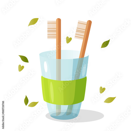 Zero waste elements with eco brush teeth in eco glass cup with decorative leaves and hearts.
