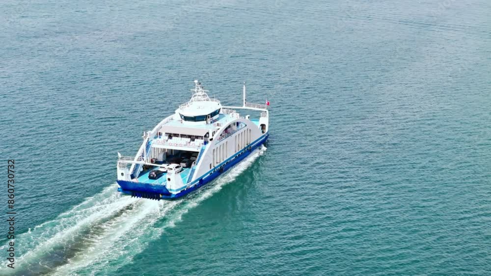 Passenger ferry boat with cars on deck cruising in sea. Sea logistics and transportation. Aerial view Passenger ferry boat with cars on deck cruising in sea. Sea logistics and transportation. Aerial view