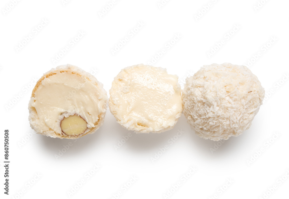 Fototapeta premium Delicious chocolate candies with coconut topping isolated on white background
