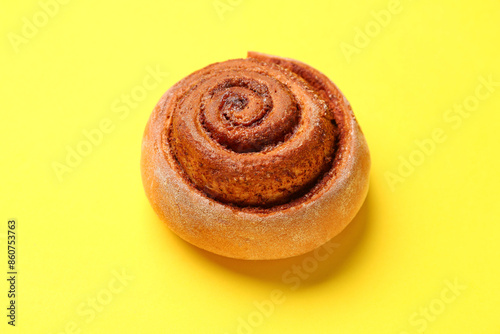 Wallpaper Mural Tasty cinnamon roll on yellow background Torontodigital.ca