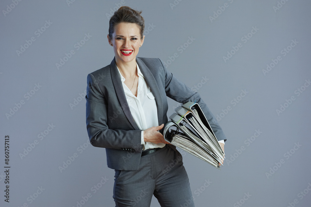 smiling elegant 40 years old business woman isolated on grey smiling elegant 40 years old business woman isolated on grey