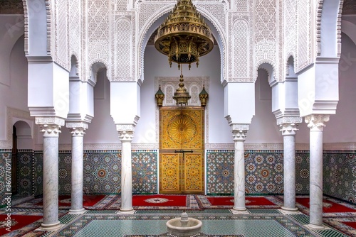 Meknes, Morocco - March 21, 2024: Mausoleum of Moulay Ismail interior in Meknes in Morocco. Mausoleum of Moulay Ismail is a tomb and mosque located in the Morocco city of Meknes photo