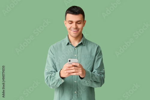 Young man using mobile phon...