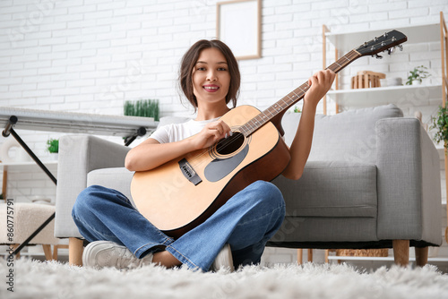 Pretty young woman playing ...