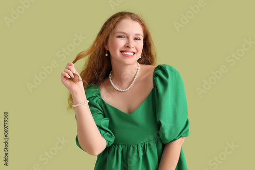 Smiling young redhead woman...