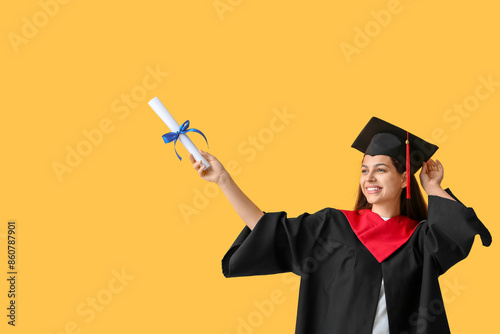 Happy female graduate with ...