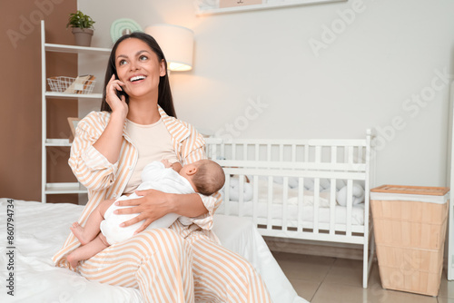 Mother breastfeeding her ba...