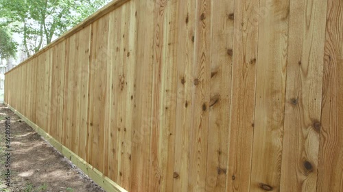 New cedar fence with wood preservative applied