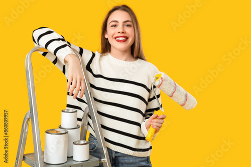 Young woman with roller and...