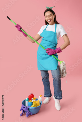Pretty young woman with mop...