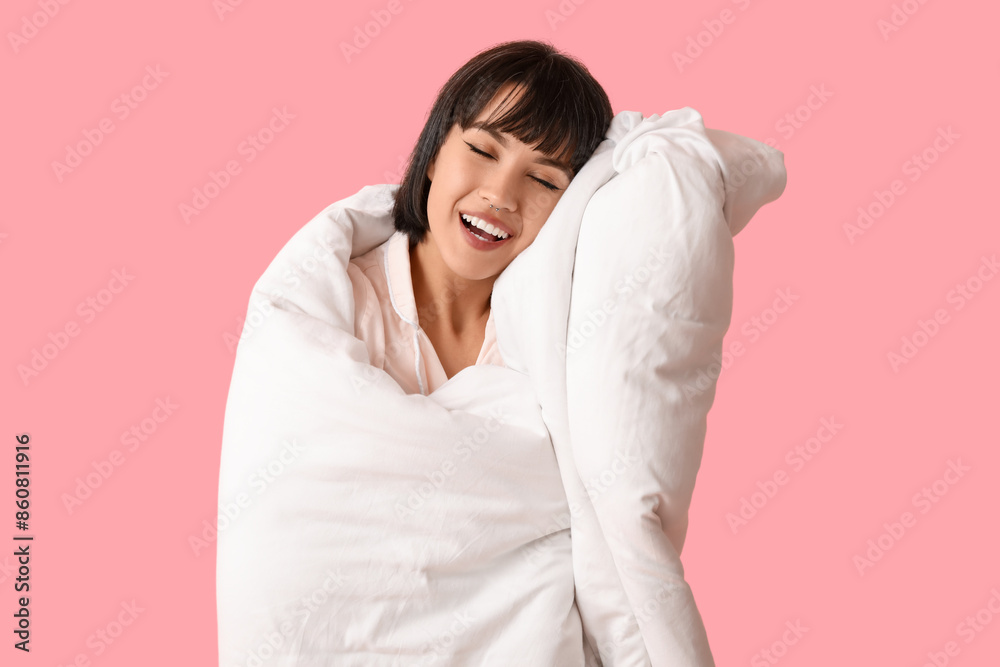 Beautiful young woman with blanket on pink background Beautiful young woman with blanket on pink background