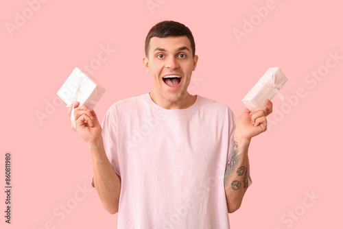Handsome man with gift boxe...