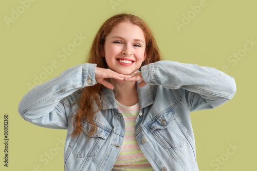 Smiling young redhead woman...