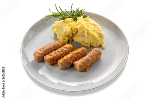 Obraz na płótnie Pieces of sausage cooked in tomato sauce with mashed potatoes and rosemary branc