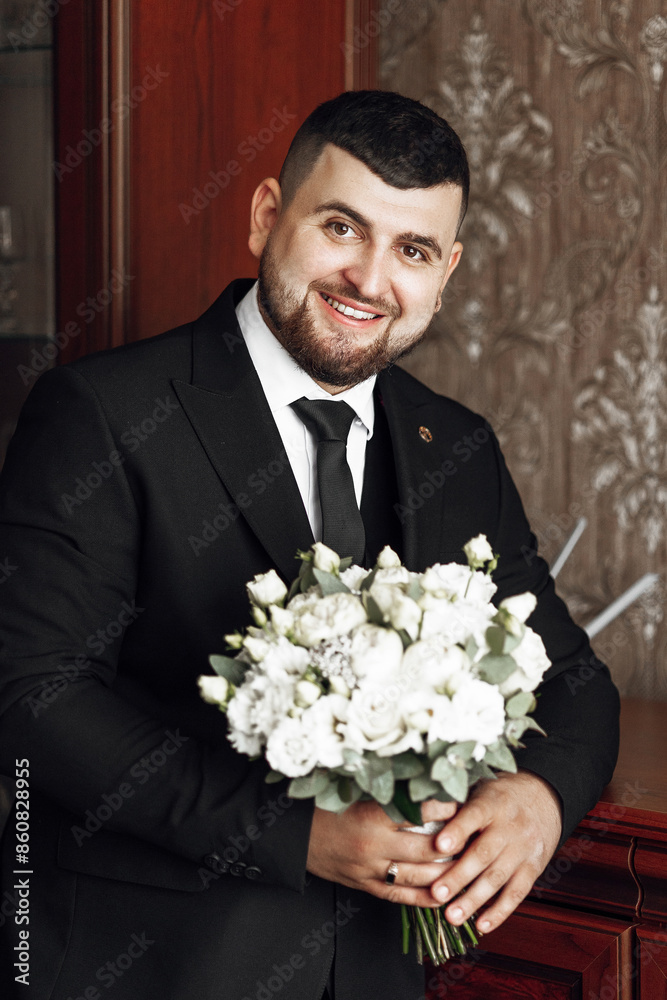 A bride and groom are kissing each other's cheeks. The bride is holding a bouquet of white flowers A bride and groom are kissing each other's cheeks. The bride is holding a bouquet of white flowers