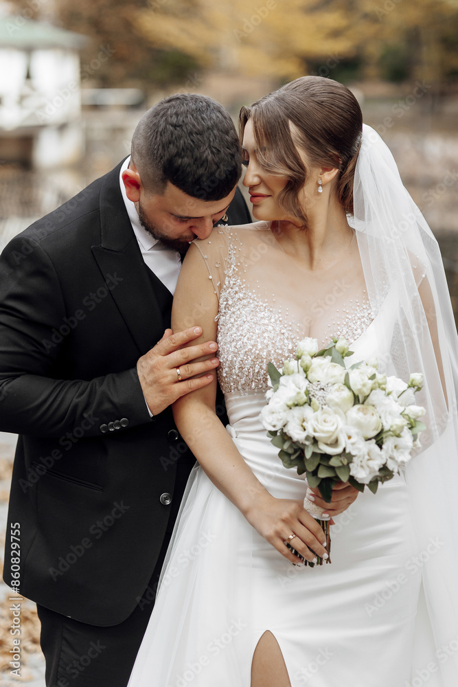 A man and woman are getting married and the man is putting a ring on the woman's finger