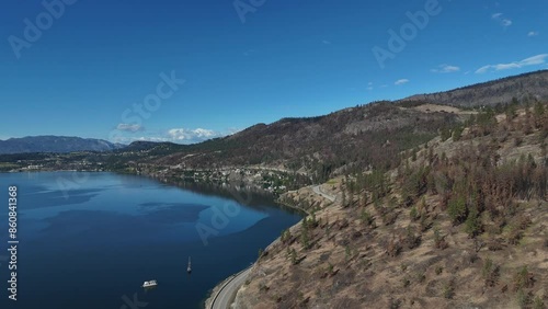 Aerial view (pan right) of Okanagan Lake at Westside Road during a spring season in West Kelowna, British Columbia, Canada