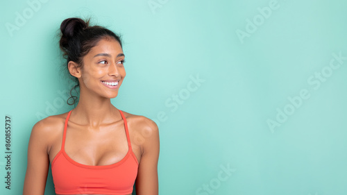 Indian woman smile wearing sportswear isolated on pastel background © pariketan