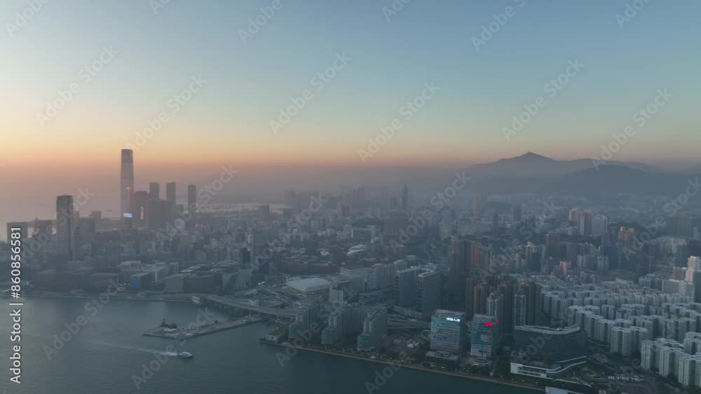 Aerial view of Hong Kong's stunning skyline and harbor, capturing the city's iconic skyscrapers, serene waters, and breathtaking sunset over Victoria Harbour Aerial view of Hong Kong's stunning skyline and harbor, capturing the city's iconic skyscrapers, serene waters, and breathtaking sunset over Victoria Harbour
