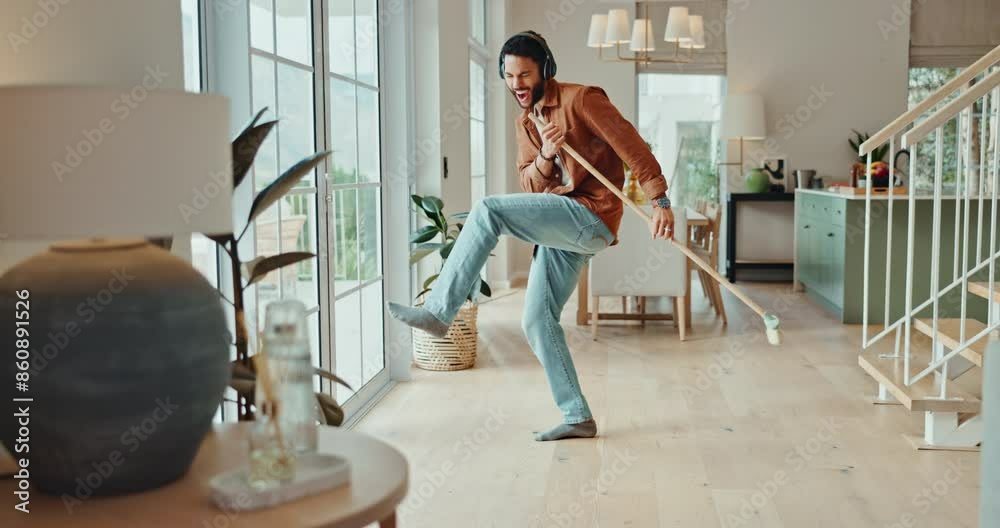 Happy, man and singing or dancing with broom while sweeping for fun cleaning, housework and chores. Excited, male person and housekeeping for hygiene with rhythm and silly moves in living room Happy, man and singing or dancing with broom while sweeping for fun cleaning, housework and chores. Excited, male person and housekeeping for hygiene with rhythm and silly moves in living room
