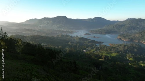 Aerial view over hills and tropical nature at the Castlereigh Reservoir in Sri Lanka photo