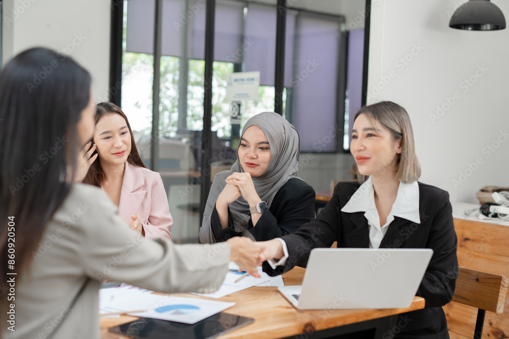 Asian Business Group Chat about graph work Present in meetings, in the office Asian Business Group Chat about graph work Present in meetings, in the office