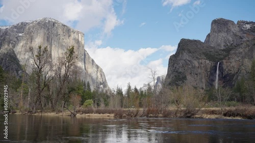 View of Yosemite Valley with Merced river moving in the foreground photo