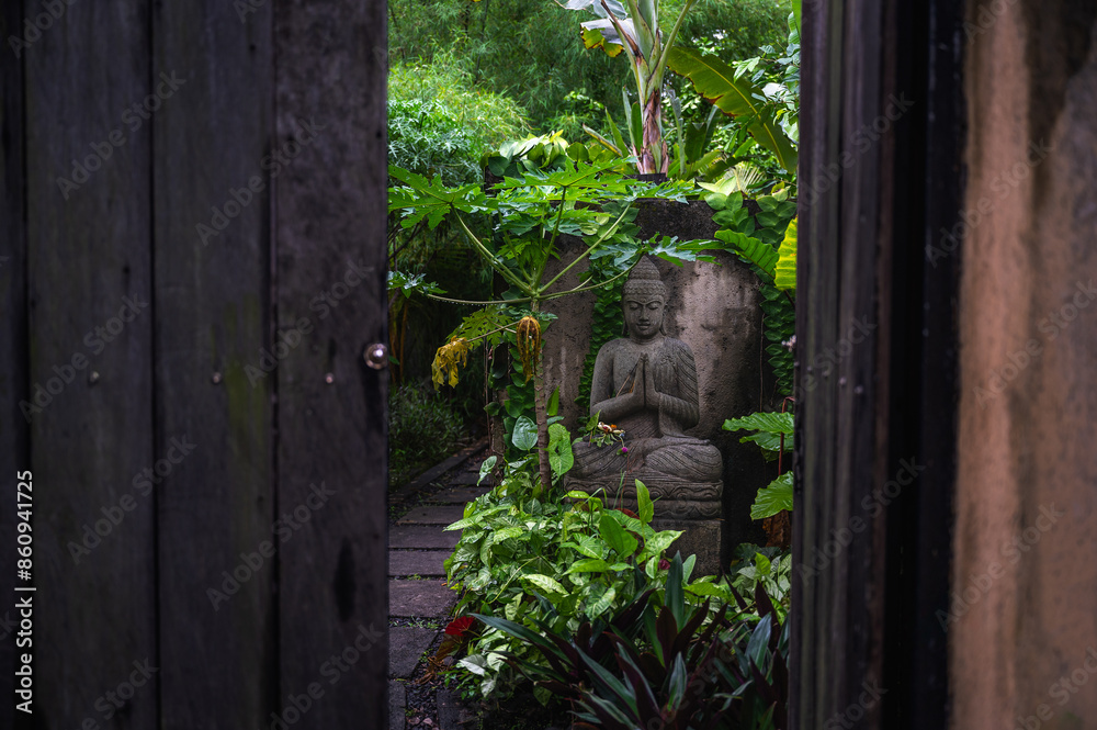 Balinese Hindu Praying Statue Surrounded By Plants