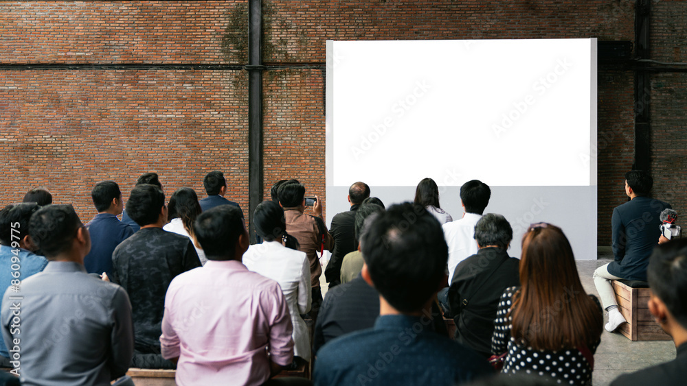 Obraz premium Front view of mockup blank white screen in vintage hall and audiences. Business and Entrepreneurship concept.