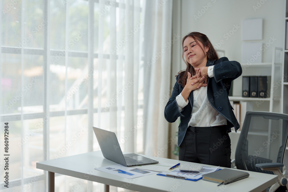 A businesswoman who is tired, stressed, and sore from working for a long time. After waiting for news Unsuccessful business approval results on laptop in office. Startup time concept, office syndrome A businesswoman who is tired, stressed, and sore from working for a long time. After waiting for news Unsuccessful business approval results on laptop in office. Startup time concept, office syndrome