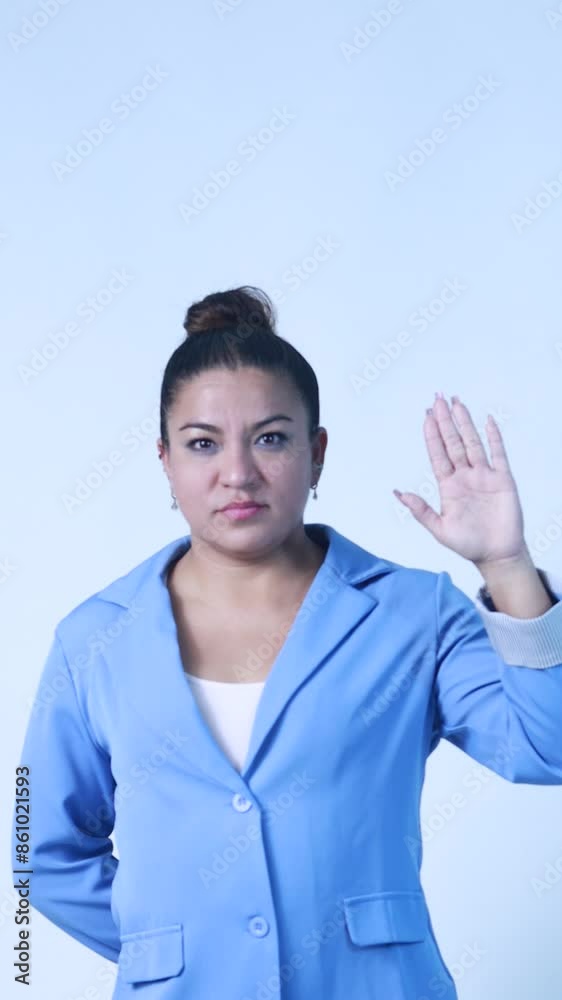 mexican business woman swearing to tell the truth in isolated white background mexican business woman swearing to tell the truth in isolated white background