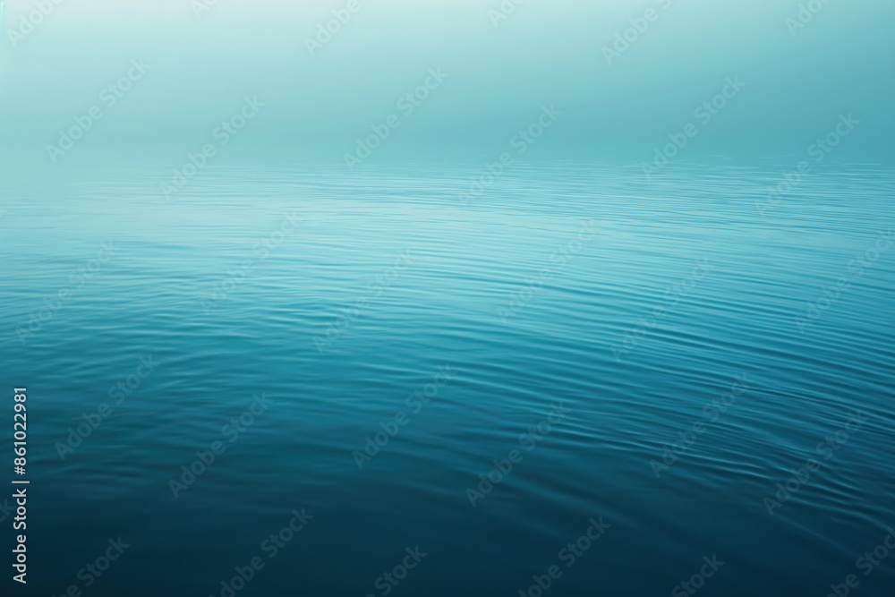 Calm ocean water surface reflecting sky gradient Calm ocean water surface reflecting sky gradient