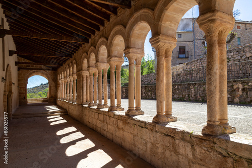 Porticoed gallery of the 13th century Church of the Savior in the town of Carabias. Guadalajara, Castile la Mancha, Spain. photo
