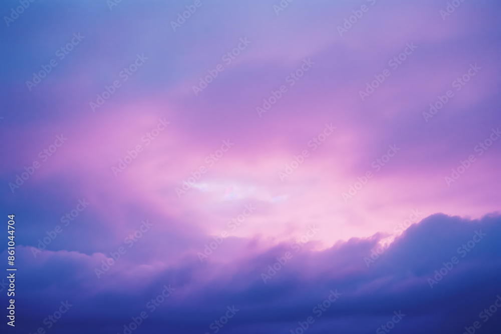 Pink and purple sunset sky with clouds creating a colorful background Pink and purple sunset sky with clouds creating a colorful background