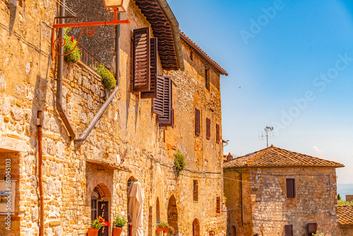 Medieval San Gimignano hill town with skyline of medieval towers, including the stone Torre Grossa. Province of Siena, Tuscany, Italy. photo